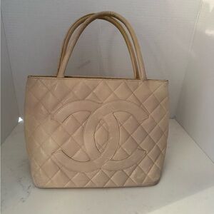 Chanel cream caviar leather tote bag.